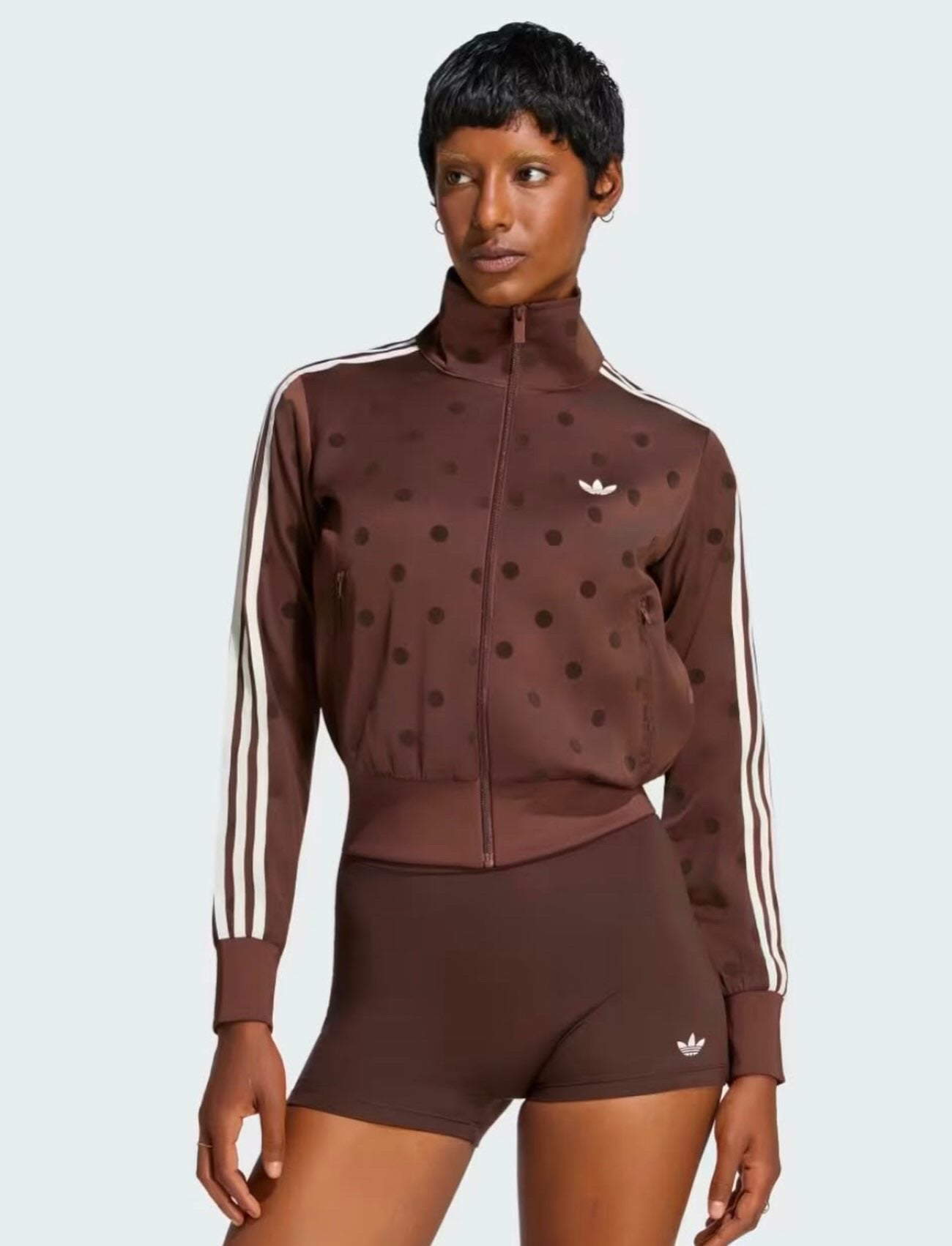 SATIN POLKA DOTS TT TRACK TOP
Standard fit track top with zipper closure for versatile styling adidas