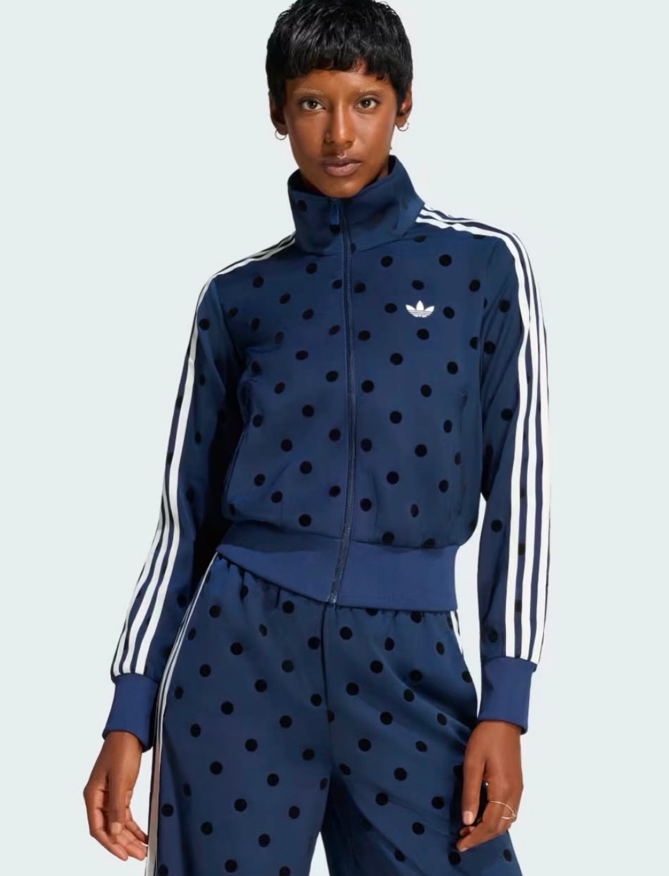 SATIN POLKA DOTS TT TRACK TOP
Standard fit track top with zipper closure for versatile styling adidas